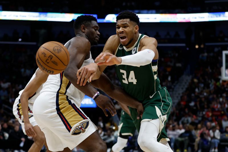 NEW ORLEANS, LOUISIANA - MARCH 28: Giannis Antetokounmpo #34 of the Milwaukee Bucks fights for a loose ball with Zion Williamson #1 of the New Orleans Pelicans at Smoothie King Center on March 28, 2024 in New Orleans, Louisiana. NOTE TO USER: User expressly acknowledges and agrees that, by downloading and or using this photograph, User is consenting to the terms and conditions of the Getty Images License Agreement.  (Photo by Chris Graythen/Getty Images)