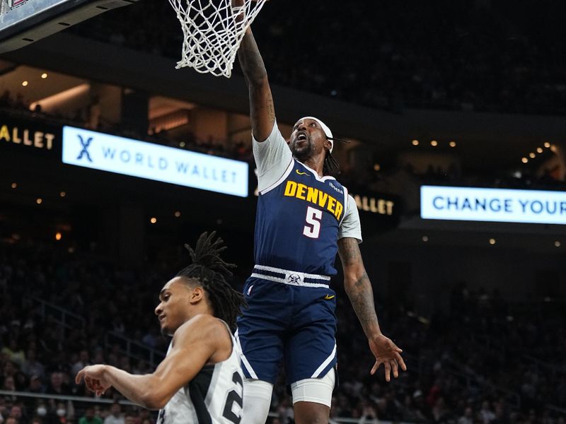 AUSTIN, TX - MARCH 15: Kentavious Caldwell-Pope #5 of the Denver Nuggets drives to the basket during the game against the San Antonio Spurs on March 15, 2024 at the Moody Center in Austin, Texas. NOTE TO USER: User expressly acknowledges and agrees that, by downloading and/or using this Photograph, user is consenting to the terms and conditions of the Getty Images License Agreement. Mandatory Copyright Notice: Copyright 2024 NBAE (Photo by Garrett Ellwood/NBAE via Getty Images)