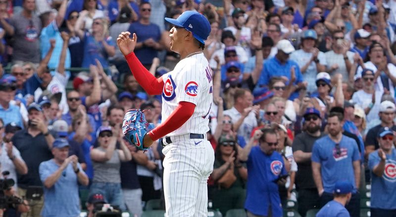 Aug 19, 2023; Chicago, Illinois, USA; Chicago Cubs relief pitcher Adbert Alzolay (73) reacts after getting the final out against the Kansas City Royals during the ninth inning at Wrigley Field. Mandatory Credit: David Banks-USA TODAY Sports