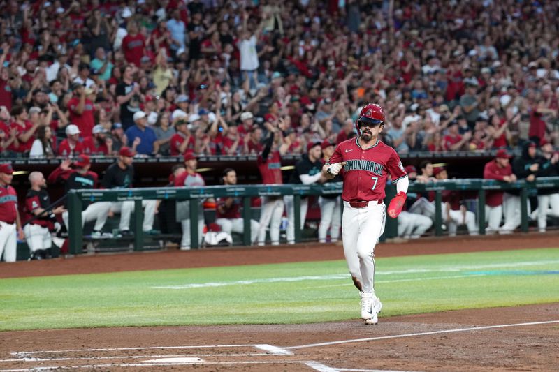 May 25, 2024; Phoenix, Arizona, USA; Arizona Diamondbacks outfielder Corbin Carroll (7) scores a run against the Miami Marlins during the first inning at Chase Field. Mandatory Credit: Joe Camporeale-USA TODAY Sports