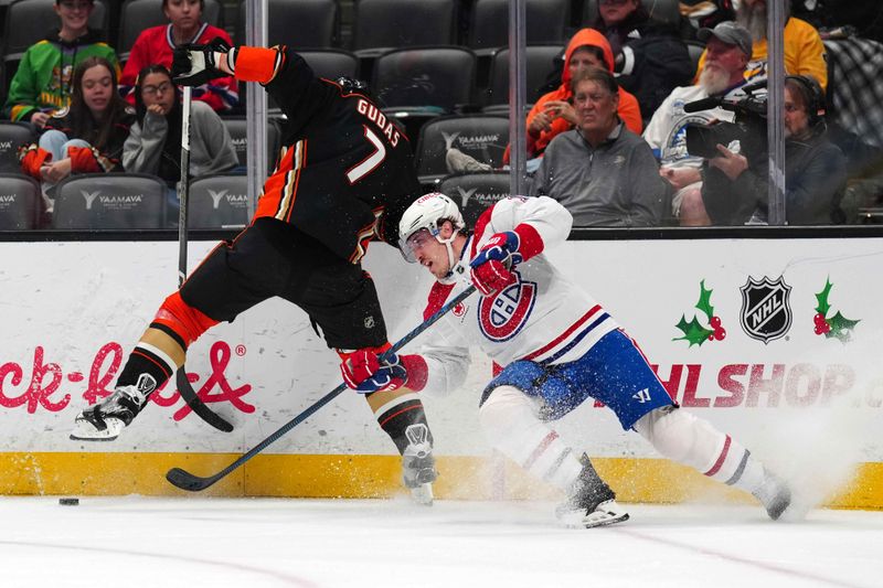 Nov 22, 2023; Anaheim, California, USA; Montreal Canadiens right wing Brendan Gallagher (11) and Anaheim Ducks defenseman Radko Gudas (7) battle for the puck in the first period at Honda Center. Mandatory Credit: Kirby Lee-USA TODAY Sports