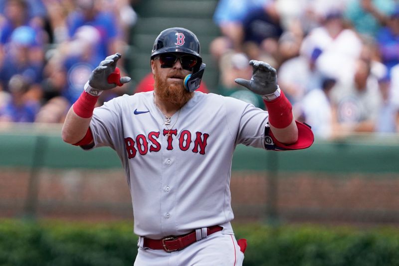 Jul 15, 2023; Chicago, Illinois, USA; Boston Red Sox designated hitter Justin Turner (2) gestures after hitting a double against the Chicago Cubs during the first inning at Wrigley Field. Mandatory Credit: David Banks-USA TODAY Sports