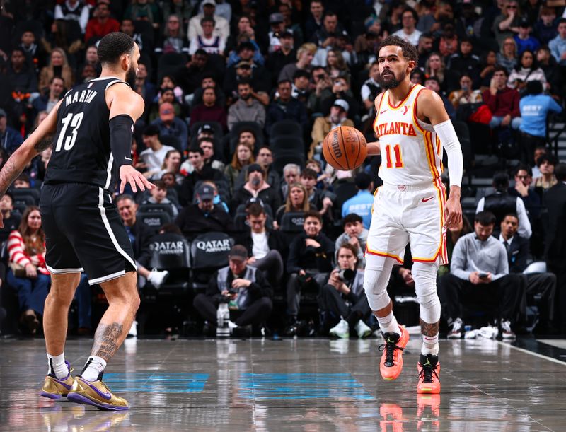 BROOKLYN, NY - MARCH 16: Trae Young #11 of the Atlanta Hawks dribbles the ball during the game against the Brooklyn Nets on March 16, 2025 at Barclays Center in Brooklyn, New York. NOTE TO USER: User expressly acknowledges and agrees that, by downloading and or using this Photograph, user is consenting to the terms and conditions of the Getty Images License Agreement. Mandatory Copyright Notice: Copyright 2025 NBAE (Photo by David L. Nemec/NBAE via Getty Images)