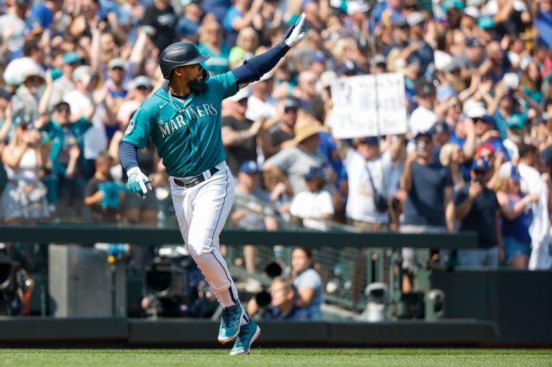 Aug 28, 2023; Seattle, Washington, USA; Seattle Mariners right fielder Teoscar Hernandez (35) waves to the bullpen while running the bases after hitting a grand slam home run against the Kansas City Royals during the third inning at T-Mobile Park. Mandatory Credit: Joe Nicholson-USA TODAY Sports