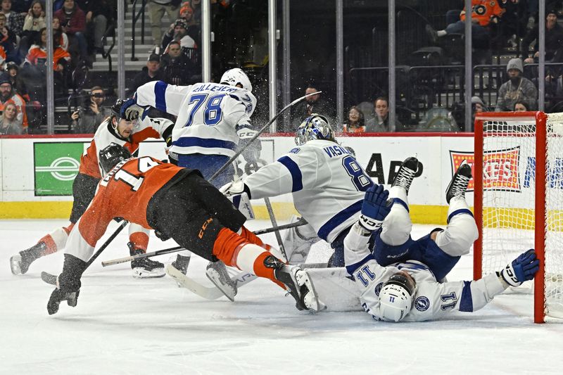 Jan 23, 2024; Philadelphia, Pennsylvania, USA;  Philadelphia Flyers center Sean Couturier (14) and Tampa Bay Lightning center Luke Glendening (11) collide in front of  goaltender Andrei Vasilevskiy (88) during the third period at Wells Fargo Center. Mandatory Credit: Eric Hartline-USA TODAY Sports