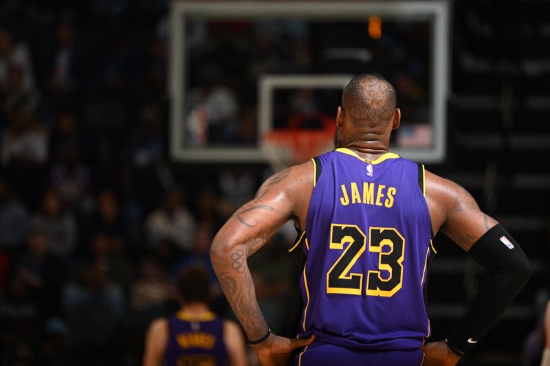 MEMPHIS, TN - NOVEMBER 6: LeBron James #23 of the Los Angeles Lakers looks on during the game against the Memphis Grizzlies on November 6, 2024 at FedExForum in Memphis, Tennessee. NOTE TO USER: User expressly acknowledges and agrees that, by downloading and or using this photograph, User is consenting to the terms and conditions of the Getty Images License Agreement. Mandatory Copyright Notice: Copyright 2024 NBAE (Photo by Grant Burke/NBAE via Getty Images)
