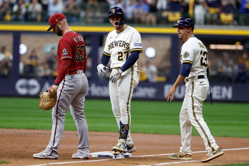 Oct 4, 2023; Milwaukee, Wisconsin, USA; Milwaukee Brewers shortstop Willy Adames (27) reacts at first base against Arizona Diamondbacks first baseman Christian Walker (53) in the first inning during game two of the Wildcard series for the 2023 MLB playoffs at American Family Field. Mandatory Credit: Kamil Krzaczynski-USA TODAY Sports