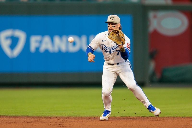 May 17, 2025; Kansas City, Missouri, USA; Kansas City Royals shortstop Bobby Witt Jr. (7) reaches for a hit ball during the eighth inning against the St. Louis Cardinals at Kauffman Stadium. Mandatory Credit: William Purnell-Imagn Images