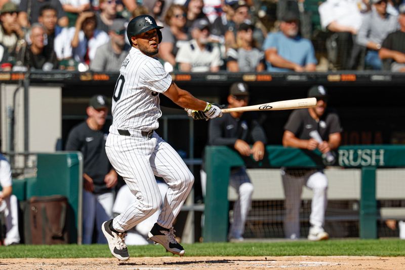 Sep 26, 2024; Chicago, Illinois, USA; Chicago White Sox third base Lenyn Sosa (50) hits a two-run double against the Los Angeles Angels during the fifth inning at Guaranteed Rate Field. Mandatory Credit: Kamil Krzaczynski-Imagn Images