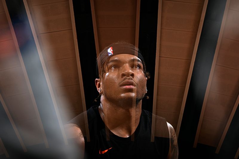 NEW YORK, NY - MARCH 31: EDITORS NOTE: This image has been produced using a double exposure. Miles McBride #2 of the New York Knicks warms up before the game against the Oklahoma City Thunder on March 31, 2024 at Madison Square Garden in New York City, New York.  NOTE TO USER: User expressly acknowledges and agrees that, by downloading and or using this photograph, User is consenting to the terms and conditions of the Getty Images License Agreement. Mandatory Copyright Notice: Copyright 2024 NBAE  (Photo by David Dow/NBAE via Getty Images)