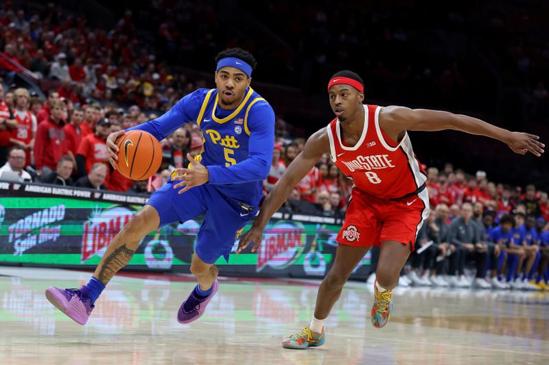 Nov 29, 2024; Columbus, Ohio, USA; Pittsburgh Panthers guard Ishmael Leggett (5) drives to the basket as Ohio State Buckeyes guard Micah Parrish (8)) defends during the first half at Value City Arena. Mandatory Credit: Joseph Maiorana-Imagn Images