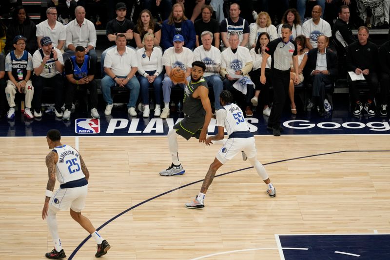 MINNEAPOLIS, MN - MAY 30: Karl-Anthony Towns #32 of the Minnesota Timberwolves dribbles the ball during the game against the Dallas Mavericks during Game 5 of the Western Conference Finals of the 2024 NBA Playoffs on May 30, 2024 at Target Center in Minneapolis, Minnesota. NOTE TO USER: User expressly acknowledges and agrees that, by downloading and or using this Photograph, user is consenting to the terms and conditions of the Getty Images License Agreement. Mandatory Copyright Notice: Copyright 2024 NBAE (Photo by Jordan Johnson/NBAE via Getty Images)