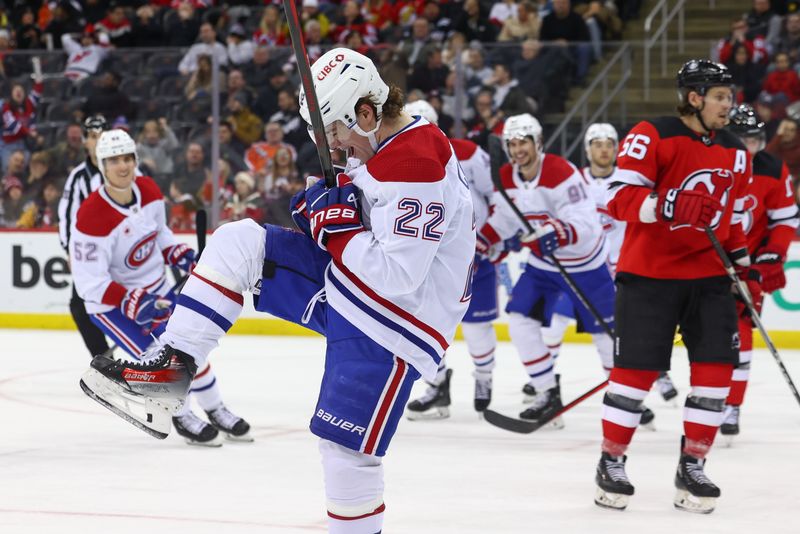 Jan 17, 2024; Newark, New Jersey, USA; Montreal Canadiens right wing Cole Caufield (22) celebrates his goal against the New Jersey Devils during the third period at Prudential Center. Mandatory Credit: Ed Mulholland-USA TODAY Sports