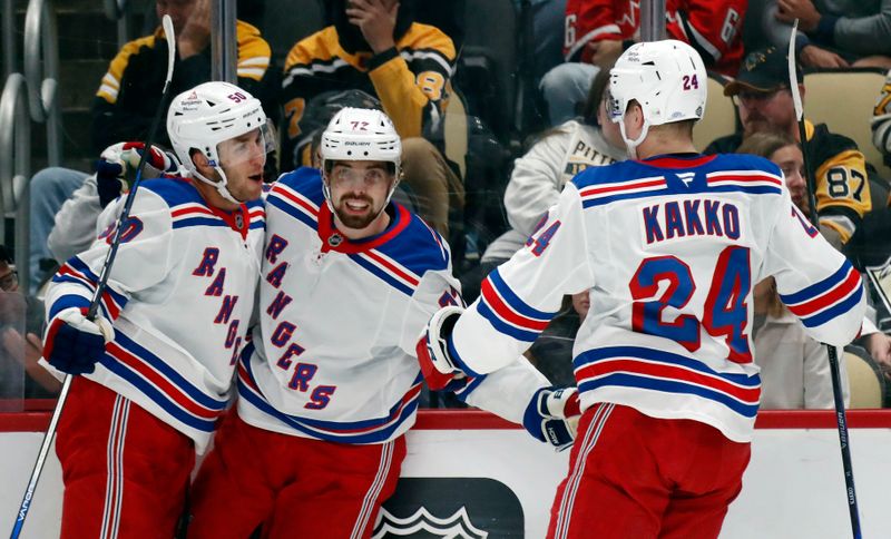 Oct 9, 2024; Pittsburgh, Pennsylvania, USA;  New York Rangers left wing Will Cuylle (left) and right wing Kaapo Kakko (24) congratulate center Filip Chytil (middle) on his goal against the Pittsburgh Penguins during the second period at PPG Paints Arena. Mandatory Credit: Charles LeClaire-Imagn Images