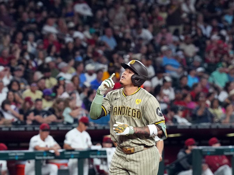 May 3, 2024; Phoenix, Arizona, USA;  San Diego Padres third base Manny Machado (13) crosses home plate after hitting a home run against the Arizona Diamondbacks during the fifth inning at Chase Field. Mandatory Credit: Joe Camporeale-USA TODAY Sports