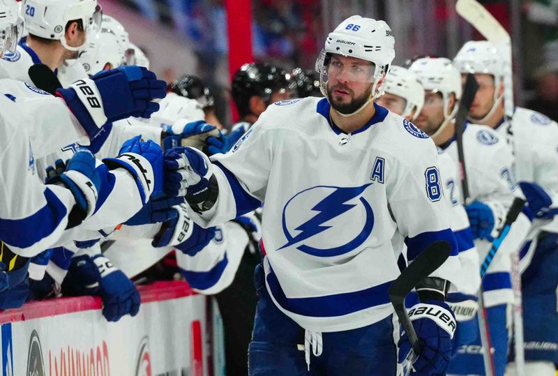 Nov 24, 2023; Raleigh, North Carolina, USA; Tampa Bay Lightning right wing Nikita Kucherov (86) celebrates his goal against the Carolina Hurricanes during the third period at PNC Arena. Mandatory Credit: James Guillory-USA TODAY Sports