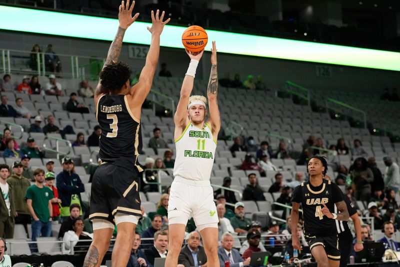 Mar 16, 2024; Fort Worth, TX, USA;  South Florida Bulls forward Kasean Pryor (11) shoots against UAB Blazers forward Yaxel Lendeborg (3) during the first half at Dickies Arena. Mandatory Credit: Chris Jones-USA TODAY Sports