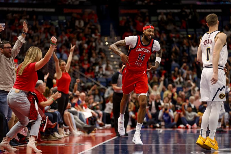 NEW ORLEANS, LOUISIANA - NOVEMBER 15:  Brandon Ingram #14 of the New Orleans Pelicans reacts after hitting a three point basket against the Denver Nuggets during the first half of an Emirates NBA Cup game at the Smoothie King Center on November 15, 2024 in New Orleans, Louisiana. NOTE TO USER: User expressly acknowledges and agrees that, by downloading and or using this photograph, User is consenting to the terms and conditions of the Getty Images License Agreement. (Photo by Derick E. Hingle/Getty Images)