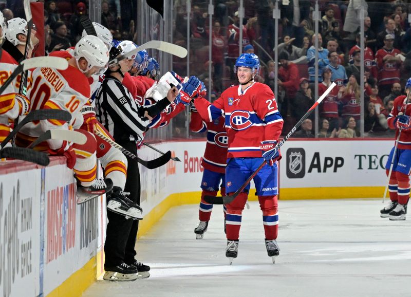 Nov 14, 2023; Montreal, Quebec, CAN; Montreal Canadiens defenseman Gustav Lindstrom (27) celebrates with teammates after scoring a goal against the Calgary Flames during the second period at the Bell Centre. Mandatory Credit: Eric Bolte-USA TODAY Sports