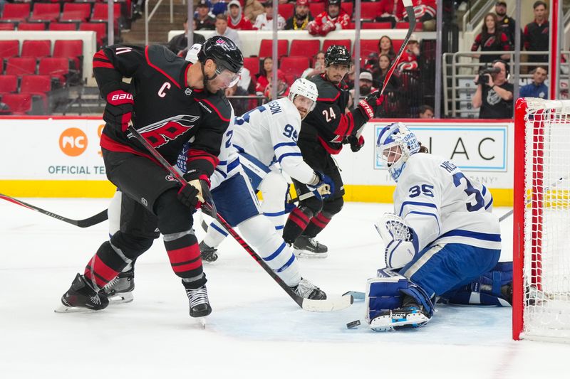 Dec 4, 2025; Raleigh, North Carolina, USA; Toronto Maple Leafs goaltender Dennis Hildeby (35) stops the scoring attempt by Carolina Hurricanes center Jordan Staal (11) during the third period at Lenovo Center. Mandatory Credit: James Guillory-Imagn Images Dec 4, 2025; Raleigh, North Carolina, USA; Toronto Maple Leafs goaltender Dennis Hildeby (35) stops the scoring attempt by Carolina Hurricanes center Jordan Staal (11) during the third period at Lenovo Center. Mandatory Credit: James Guillory-Imagn Images