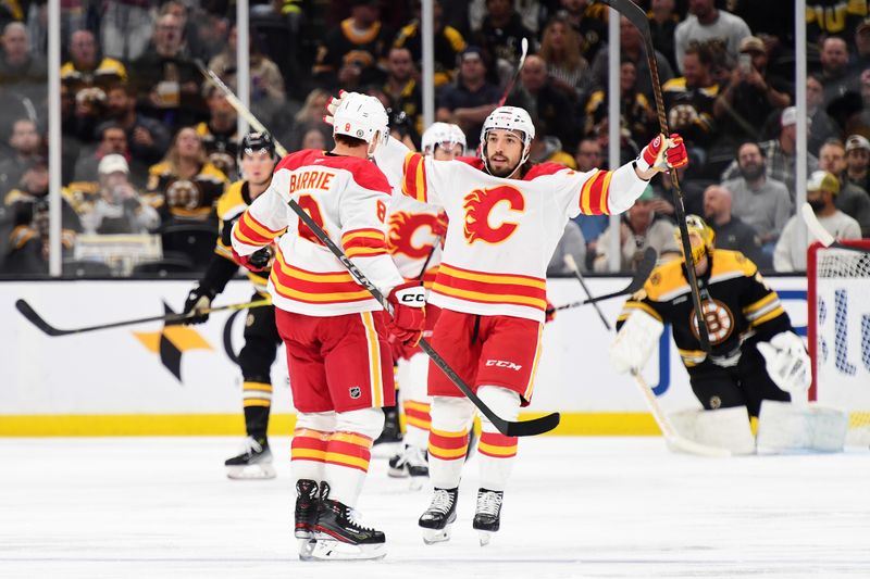 Nov 7, 2024; Boston, Massachusetts, USA;  Calgary Flames left wing Ryan Lomberg (70) reacts after a goal by defenseman Tyson Barrie (8) during the first period against the Boston Bruins at TD Garden. Mandatory Credit: Bob DeChiara-Imagn Images