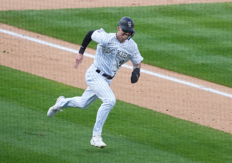 Oct 1, 2023; Denver, Colorado, USA; Colorado Rockies center fielder Brenton Doyle (9) runs home to score on a wild pitch in the eleventh inning to defeat the Minnesota Twins at Coors Field. Mandatory Credit: Ron Chenoy-USA TODAY Sports