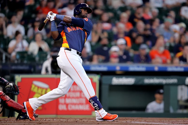 Jun 1, 2024; Houston, Texas, USA; Houston Astros designated hitter Yordan Alvarez (44) hits a two-run home run against the Minnesota Twins during the first inning at Minute Maid Park. Mandatory Credit: Erik Williams-USA TODAY Sports