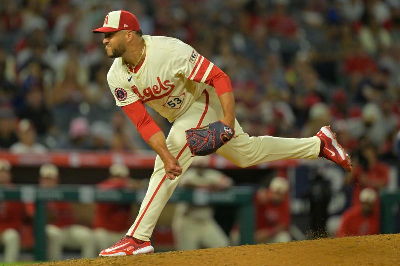 Jul 13, 2024; Anaheim, California, USA;  Carlos Estevez #53 of the Los Angeles Angels earns his 17th save of the season defeating the Seattle Mariners in the ninth inning at Angel Stadium. Mandatory Credit: Jayne Kamin-Oncea-USA TODAY Sports