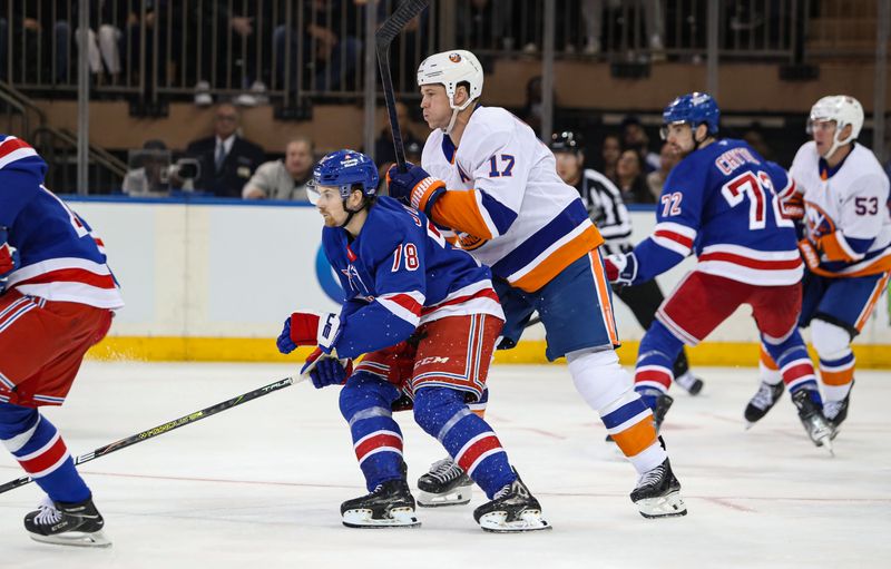 Sep 24, 2024; New York, New York, USA; New York Rangers left wing Brennan Othmann (78) and New York Islanders left wing Matt Martin (17) battle for position during the second period at Madison Square Garden. Mandatory Credit: Danny Wild-Imagn Images