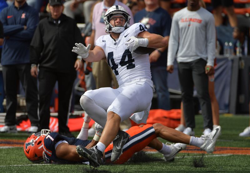 Sep 16, 2023; Champaign, Illinois, USA;  Penn State Nittany Lions tight end Tyler Warren (44) is brought down by Illinois Fighting Illini defensive back Matthew Bailey (7) during the first half at Memorial Stadium. Mandatory Credit: Ron Johnson-USA TODAY Sports