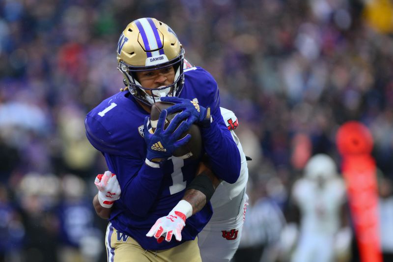 Nov 11, 2023; Seattle, Washington, USA; Washington Huskies wide receiver Rome Odunze (1) catches a pass for a touchdown while defended by Utah Utes cornerback JaTravis Broughton (4) during the second half at Alaska Airlines Field at Husky Stadium. Mandatory Credit: Steven Bisig-USA TODAY Sports