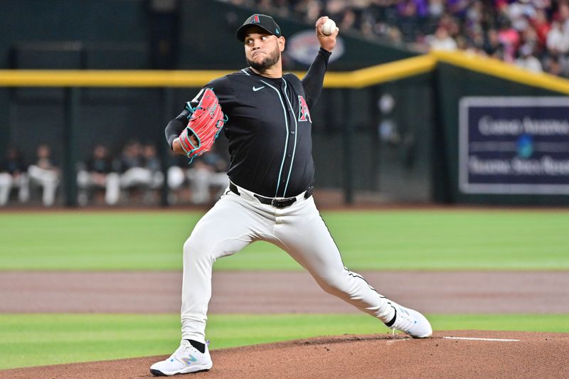 Sep 23, 2024; Phoenix, Arizona, USA;  Arizona Diamondbacks pitcher Eduardo Rodriguez (57) throws in the first inning against the San Francisco Giants at Chase Field. Mandatory Credit: Matt Kartozian-Imagn Images