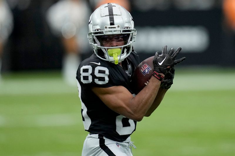 Las Vegas Raiders wide receiver Tre Tucker (89) pulls in a catch against the San Francisco 49ers during the first half of an NFL preseason football game, Sunday, Aug. 13, 2023, in Las Vegas. (AP Photo/John Locher)