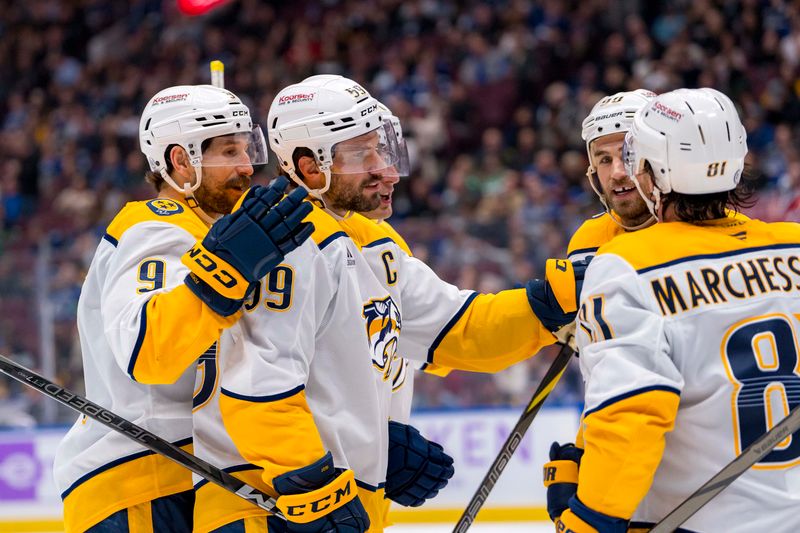 Nov 17, 2024; Vancouver, British Columbia, CAN; Nashville Predators forward Filip Forsberg (9) and defenseman Roman Josi (59) and forward Ryan O'Reilly (90) and forward Jonathan Marchessault (81) celebrate Josi’s goal against the Vancouver Canucks during the second period at Rogers Arena. Mandatory Credit: Bob Frid-Imagn Images