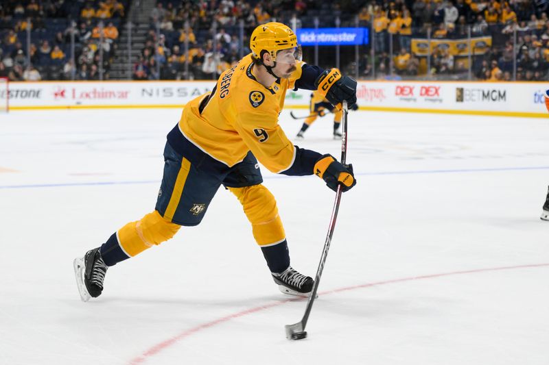 Apr 8, 2025; Nashville, Tennessee, USA;  Nashville Predators left wing Filip Forsberg (9) takes a shot on goal against the New York Islanders during the third period at Bridgestone Arena. Mandatory Credit: Steve Roberts-Imagn Images