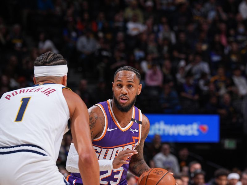 DENVER, CO - OCTOBER 13: Monte Morris #23 of the Phoenix Suns dribbles the ball during the game against the Denver Nuggets on October 13, 2024 at Ball Arena in Denver, Colorado. NOTE TO USER: User expressly acknowledges and agrees that, by downloading and/or using this Photograph, user is consenting to the terms and conditions of the Getty Images License Agreement. Mandatory Copyright Notice: Copyright 2024 NBAE (Photo by Garrett Ellwood/NBAE via Getty Images)