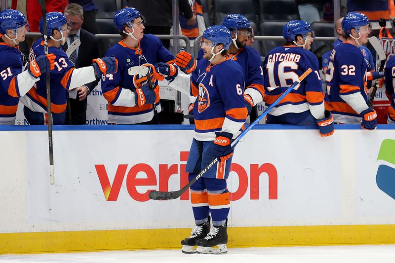 Dec 11, 2025; Elmont, New York, USA; New York Islanders defenseman Ryan Pulock (6) celebrates his goal against the Anaheim Ducks with teammates during the third period at UBS Arena. Mandatory Credit: Brad Penner-Imagn Images