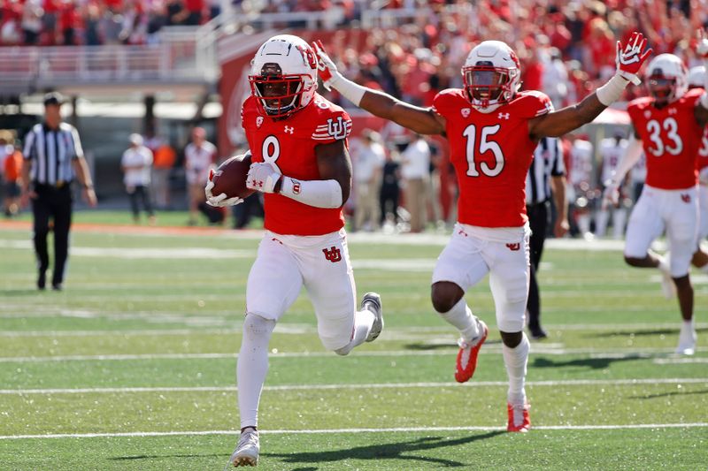 Sep 25, 2021; Salt Lake City, Utah, USA; Utah Utes cornerback Clark Phillips III (8) runs back an interception for a touchdown in the fourth quarter against the Washington State Cougars at Rice-Eccles Stadium. Mandatory Credit: Jeffrey Swinger-USA TODAY Sports