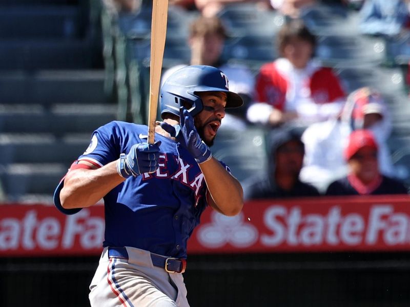 Sep 29, 2024; Anaheim, California, USA;  Texas Rangers center fielder Leody Taveras (3) breaks his bat during the ninth inning against the Los Angeles Angels at Angel Stadium. Mandatory Credit: Kiyoshi Mio-Imagn Images