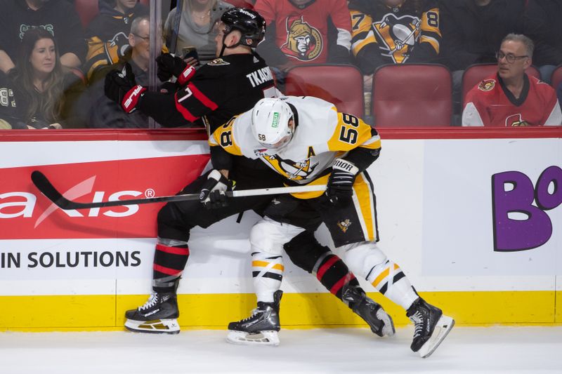 Mar 12, 2024; Ottawa, Ontario, CAN; Pittsburgh Penguins defenseman Kris Letang (58) battles with Ottawa Senators left wing Brady Tkachuk (7) in the third period at the Canadian Tire Centre. Mandatory Credit: Marc DesRosiers-USA TODAY Sports