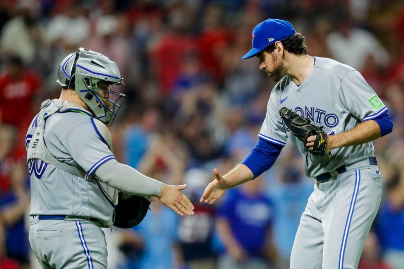 Aug 19, 2023; Cincinnati, Ohio, USA; Toronto Blue Jays catcher Alejandro Kirk (30) high fives relief pitcher Jordan Romano (68) after their victory over the Cincinnati Reds at Great American Ball Park. Mandatory Credit: Katie Stratman-USA TODAY Sports