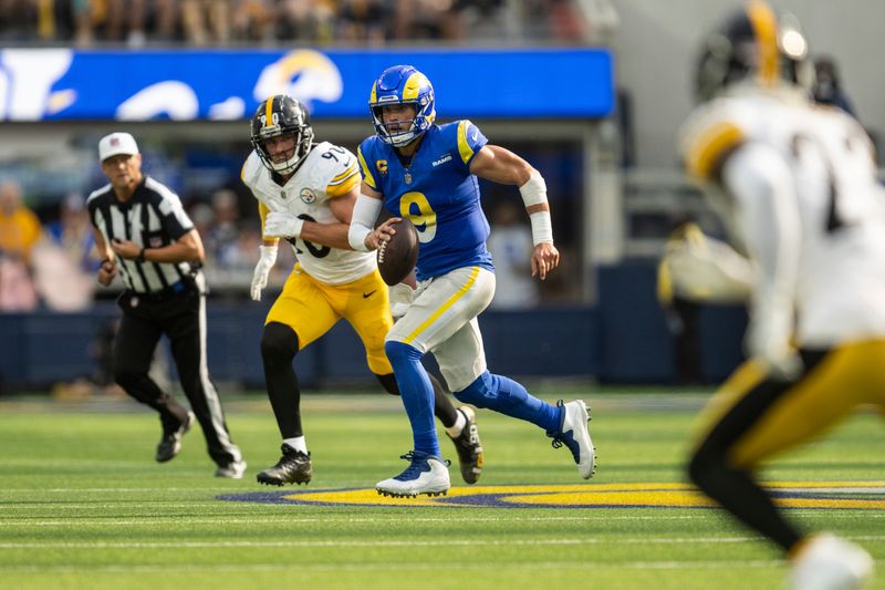 Los Angeles Rams quarterback Matthew Stafford (9) runs with the ball during an NFL football game against the Pittsburgh Steelers, Sunday, Oct. 22, 2023, in Inglewood, Calif. (AP Photo/Kyusung Gong)