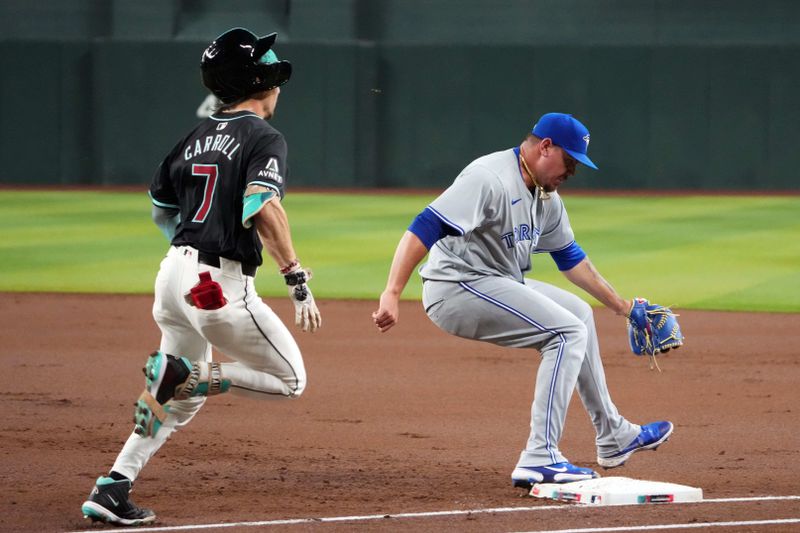 Jul 12, 2024; Phoenix, Arizona, USA; Toronto Blue Jays shortstop Leo Jiménez (49) steps on first to force out Arizona Diamondbacks outfielder Corbin Carroll (7) during the first inning at Chase Field. Mandatory Credit: Joe Camporeale-USA TODAY Sports