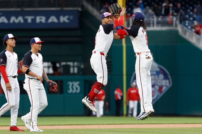May 5, 2024; Washington, District of Columbia, USA; Washington Nationals outfielder Eddie Rosario (8) celebrates with Nationals shortstop CJ Abrams (5) after their game against the Toronto Blue Jays at Nationals Park. Mandatory Credit: Geoff Burke-USA TODAY Sports