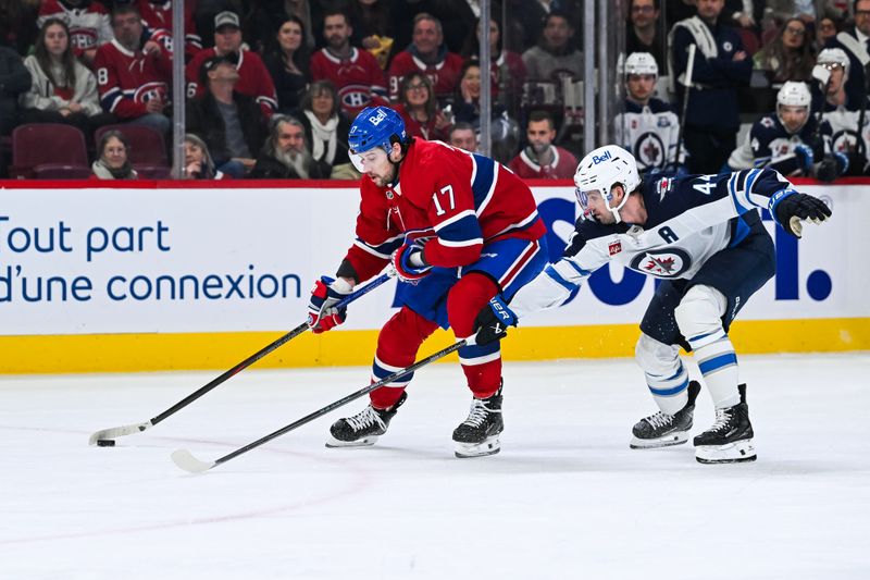 Dec 3, 2025; Montreal, Quebec, CAN; Winnipeg Jets defenseman Josh Morrissey (44) defends Montreal Canadiens right wing Josh Anderson (17) during the first period at Bell Centre. Mandatory Credit: David Kirouac-Imagn Images