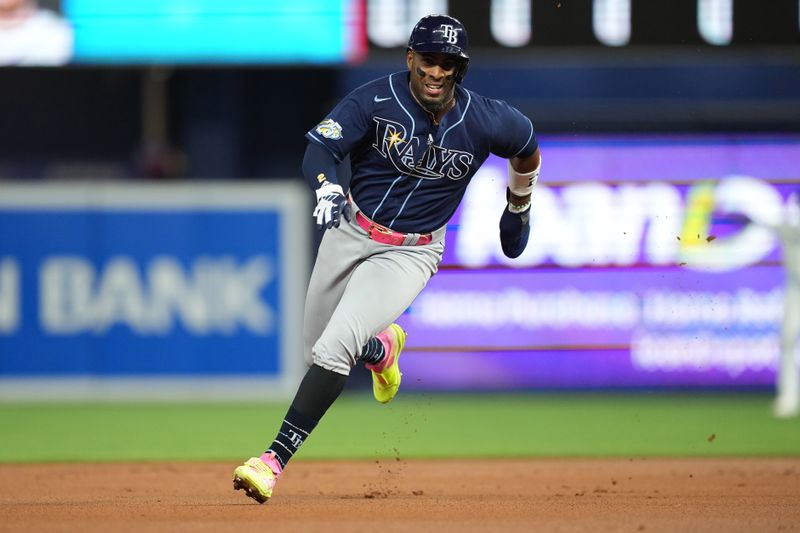 Aug 29, 2023; Miami, Florida, USA;  Tampa Bay Rays first baseman Yandy Diaz (2) advance to third base on a fielding error against the Miami Marlins in the first inning at loanDepot Park. Mandatory Credit: Jim Rassol-USA TODAY Sports