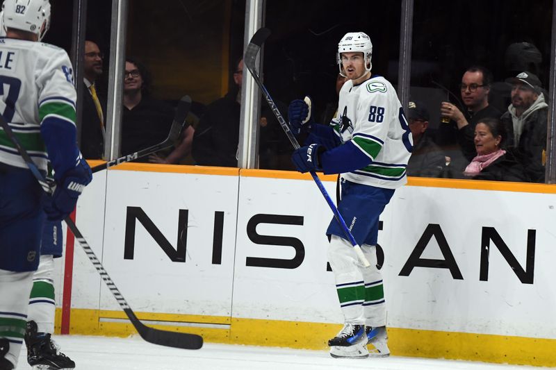 Dec 19, 2023; Nashville, Tennessee, USA; Vancouver Canucks center Nils Aman (88) celebrates after a goal during the first period against the Nashville Predators at Bridgestone Arena. Mandatory Credit: Christopher Hanewinckel-USA TODAY Sports