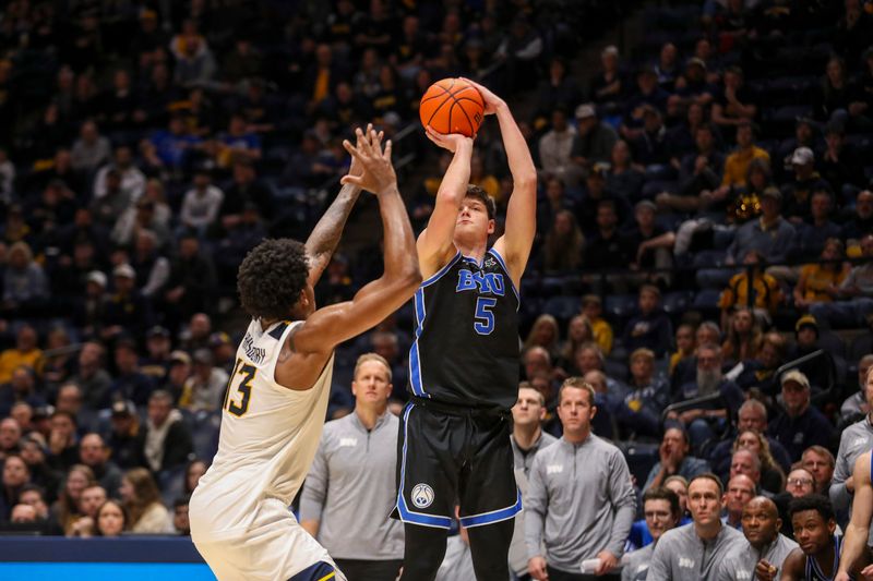 Feb 11, 2025; Morgantown, West Virginia, USA; Brigham Young Cougars forward Mihailo Boskovic (5) shoots a three pointer over West Virginia Mountaineers forward Amani Hansberry (13) during the second half at WVU Coliseum. Mandatory Credit: Ben Queen-Imagn Images