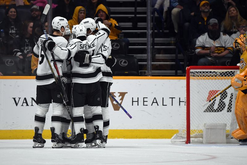 Jan 31, 2024; Nashville, Tennessee, USA; Los Angeles Kings players celebrate after a goal by center Trevor Lewis (61) during the third period against the Nashville Predators at Bridgestone Arena. Mandatory Credit: Christopher Hanewinckel-USA TODAY Sports