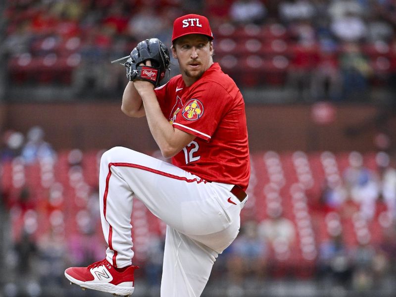 Aug 7, 2024; St. Louis, Missouri, USA;  St. Louis Cardinals starting pitcher Erick Fedde (12) pitches against the Tampa Bay Rays during the first inning at Busch Stadium. Mandatory Credit: Jeff Curry-USA TODAY Sports